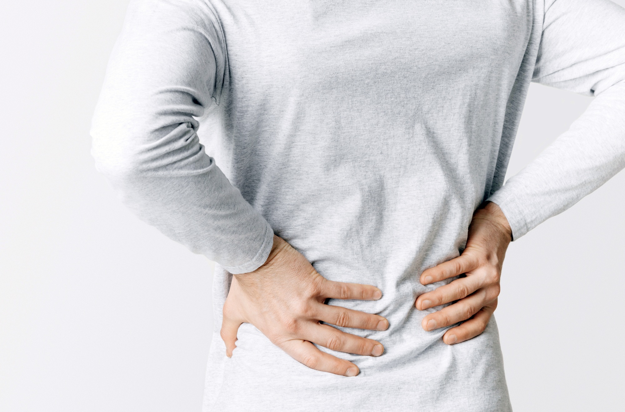 Renal colic and back pain. Man suffers from lower back pain