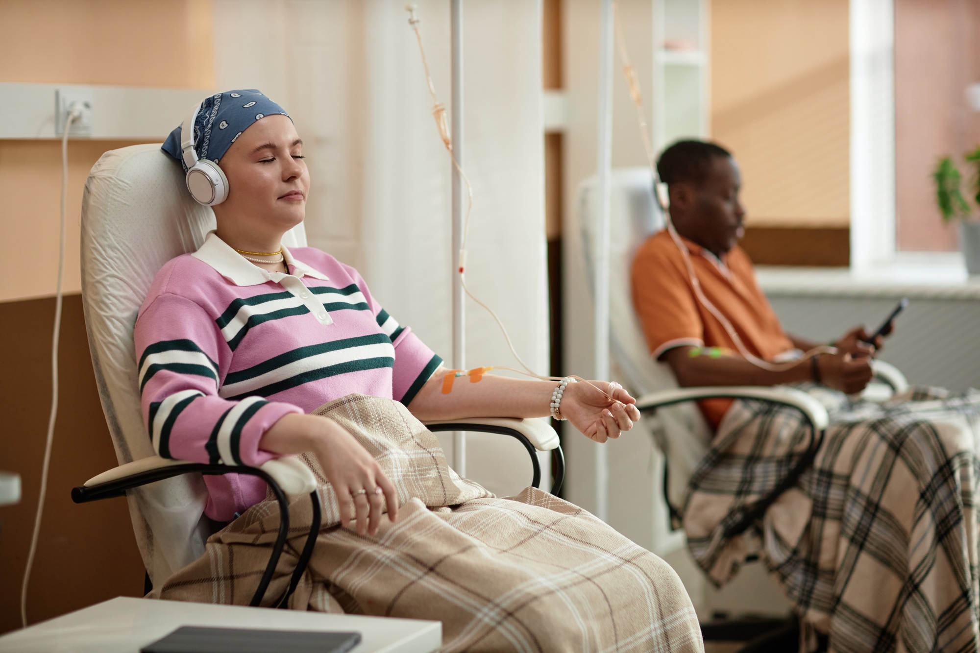 Woman Listening to Music Getting Chemotherapy Treatment